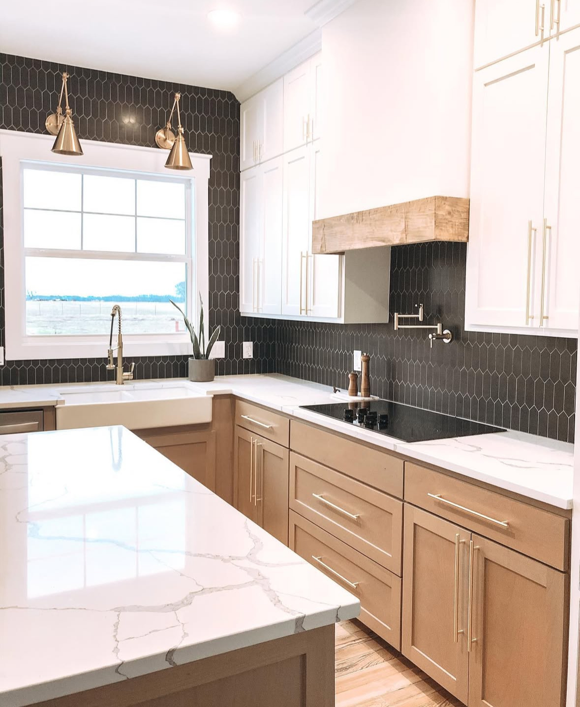 Elongated black hexagon tile wrapping around a kitchen window