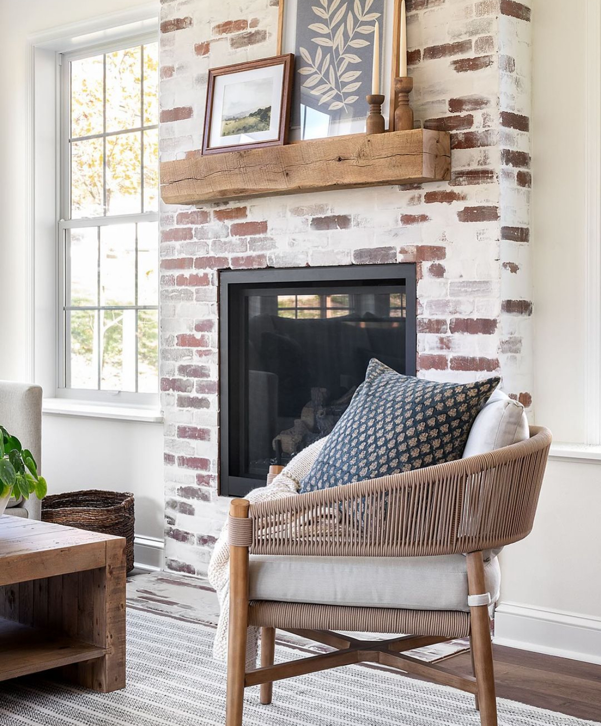 German smear brick fireplace with a simple wooden beam mantel